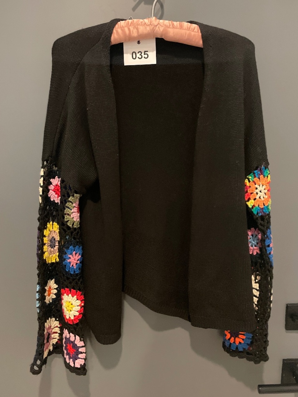 Adorable black cardigan with crochet granny square sleeves